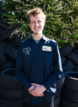 staff in front of car tires